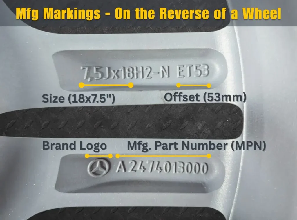 OEM rims with part number stamped behind spokes